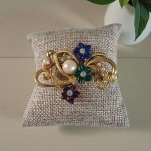 Elegant Gold Floral Brooch with Multicolor Accents